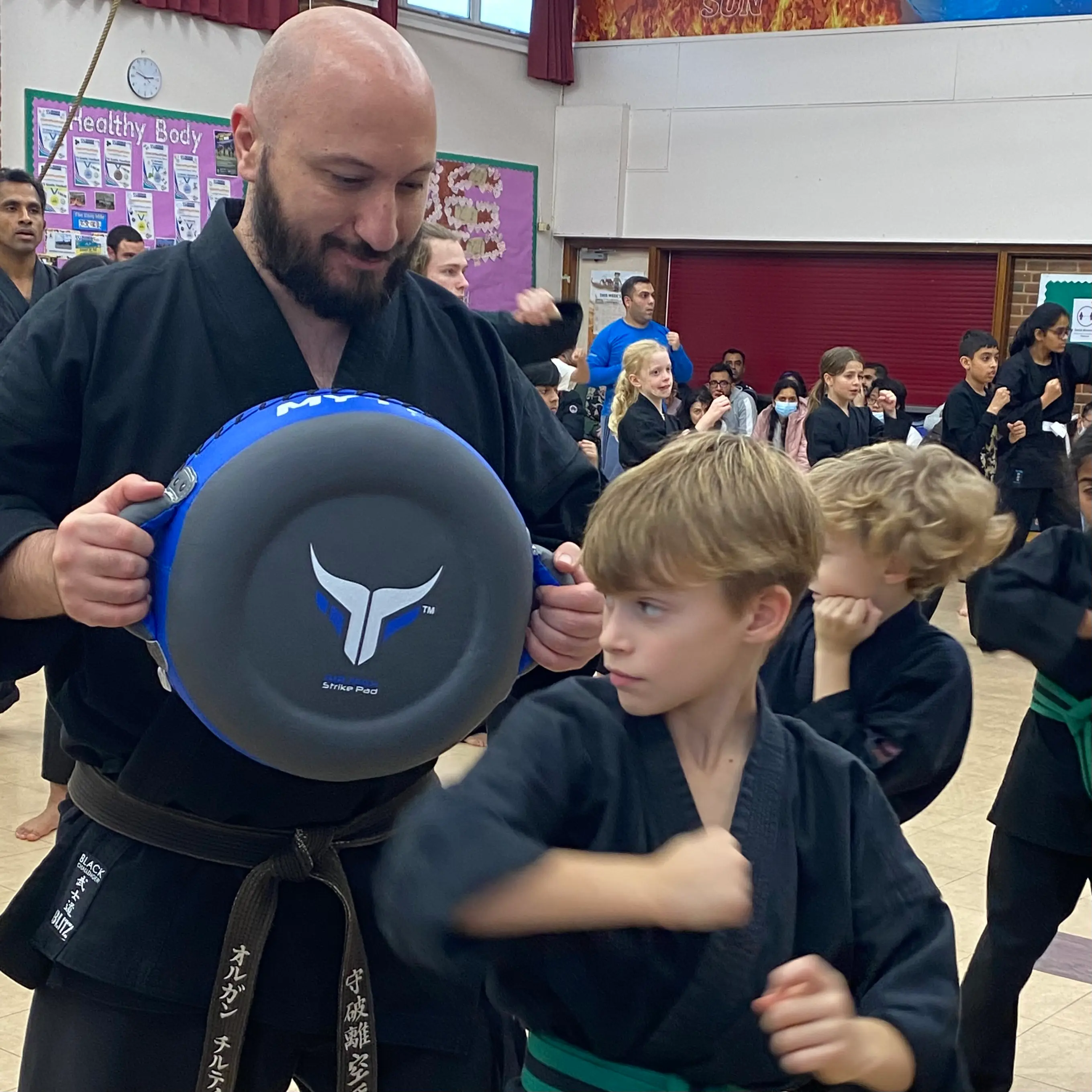Olgun Tiltay teaching students in grading